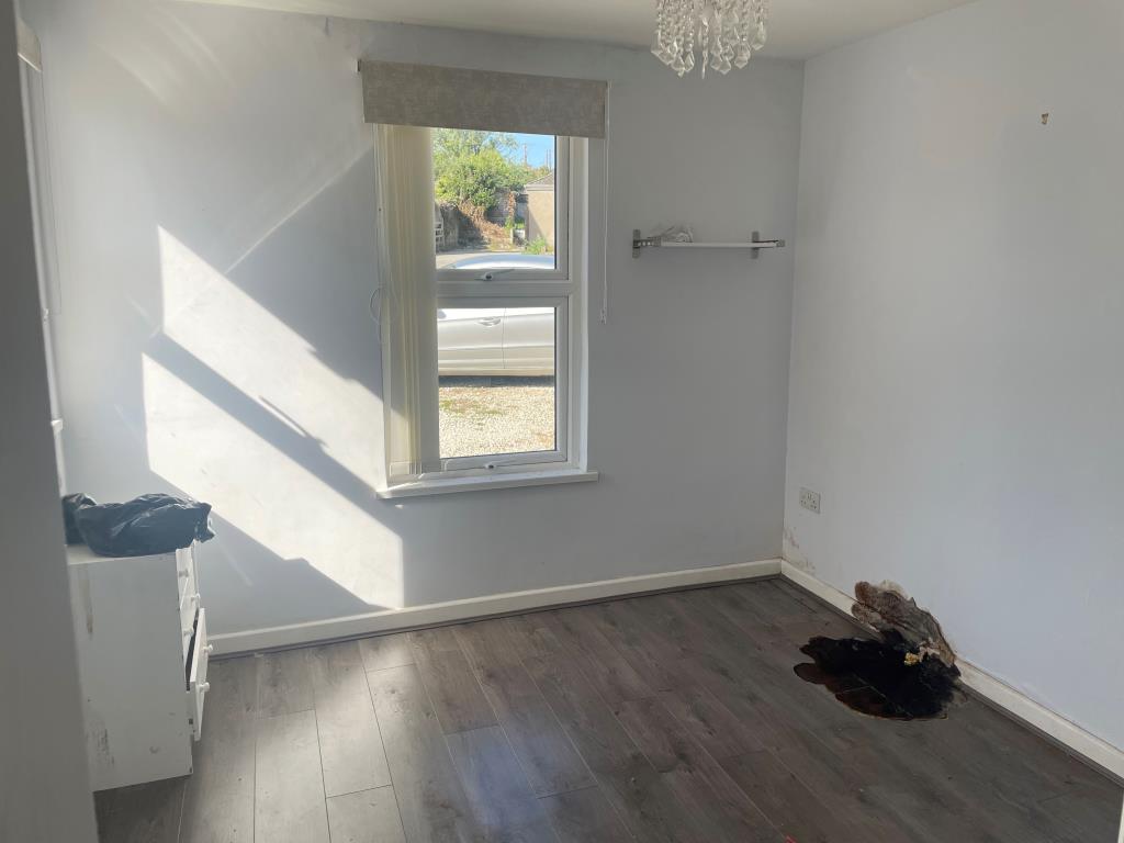 Lot: 44 - GROUND FLOOR FLAT FOR IMPROVEMENT - Front elevation of property with area of off road parking
